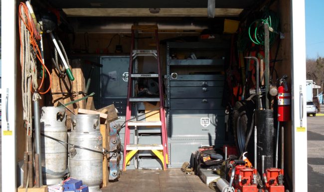 Photograph of inside rigging truck showing storage and equipment